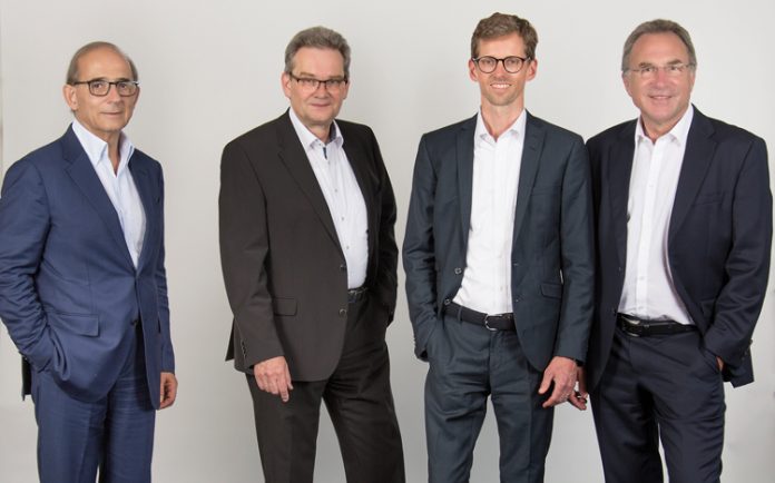 The new Isra Vision management team (from right: Hans Jürgen Christ, Tomas Lundin (speaker), Dr Johannes Giet) takes over from the retiring CEO and founder Enis Ersü (left)