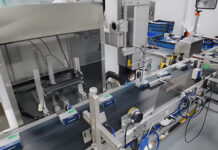 Sophisticated machine vision solution for pharma The machine vision setup consists of a sensor that triggers the camera (bottom center of the image) as soon as the component is within the camera's field of view.